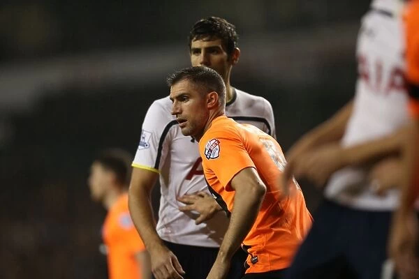 Aaron Hughes in Action: Tottenham vs. Brighton & Hove Albion in the Capital One Cup