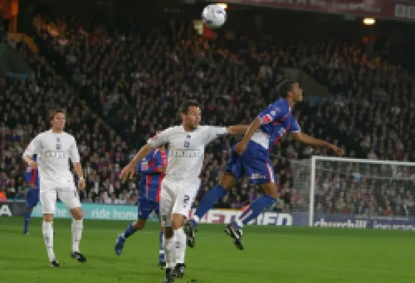 Buy Paul Reid goes up for a header