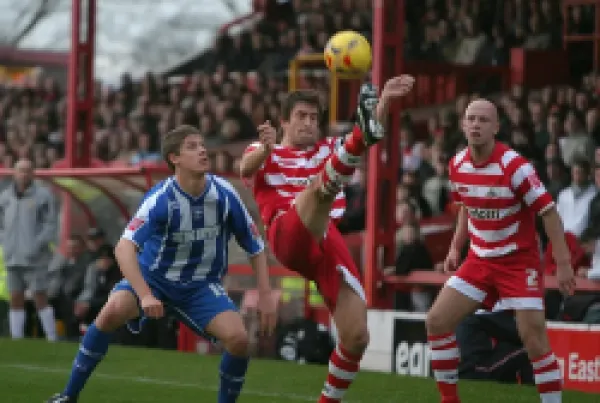 Buy Alex Revell watches Graeme Lee clear the ball