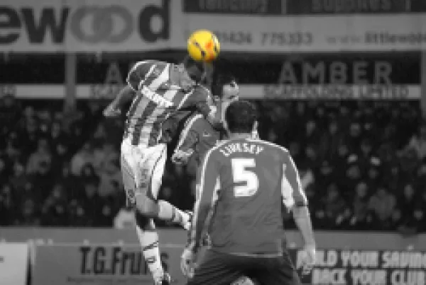 Buy Joel Lynch heads the ball