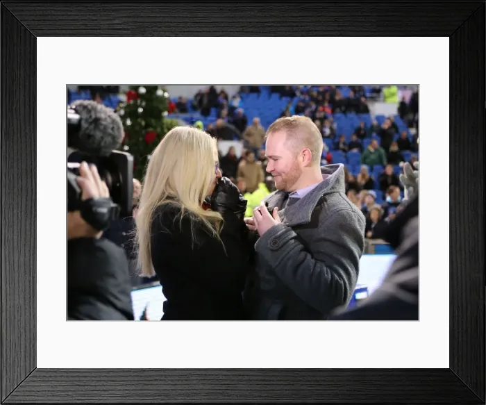 Framed Print : A Romantic Moment at the Football Field: Jamie Howell Proposes to Kristina Sinclair during Brighton and Hove Albion vs. Millwall (12DEC14) Framed Print : A Romantic Moment at the Football Field: Jamie Howell Proposes to Kristina Sinclair during Brighton and Hove Albion vs. Millwall (12DEC14)