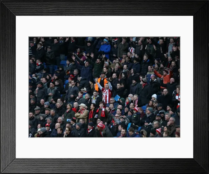 Framed Print : Brentford Fans Amidst the Action: Brighton & Hove Albion vs. Brentford (17Jan15)