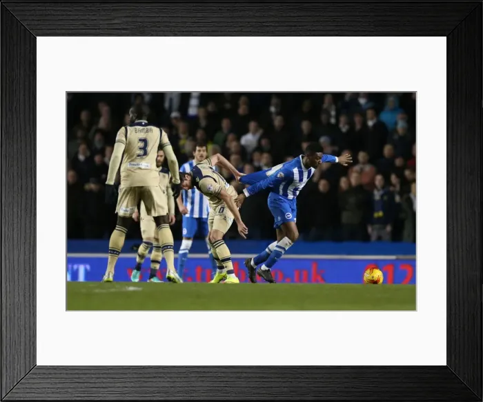 Framed Print : Tug-of-War in Midfield: Rohan Ince Caught in the Middle during Brighton & Hove Albion vs Leeds United (24FEB15) Framed Print : Tug-of-War in Midfield: Rohan Ince Caught in the Middle during Brighton & Hove Albion vs Leeds United (24FEB15)
