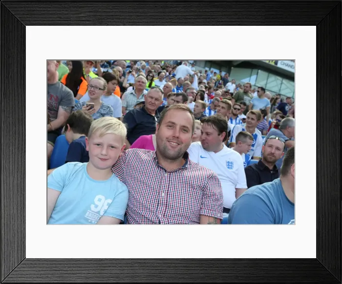 Framed Print : Brighton & Hove Albion Fans Cheer at the American Express Community Stadium During Pre-season Friendly Against Sevilla FC (2015) Framed Print : Brighton & Hove Albion Fans Cheer at the American Express Community Stadium During Pre-season Friendly Against Sevilla FC (2015)