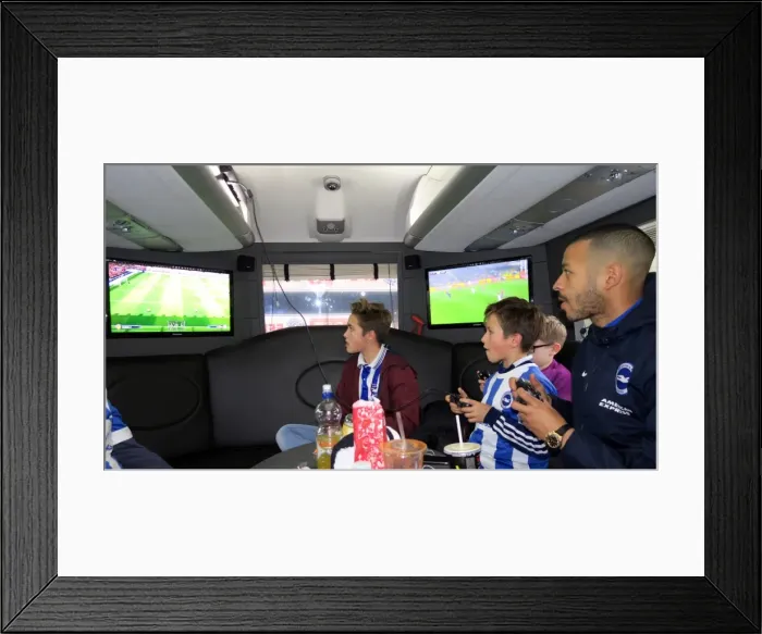 Framed Print : Brighton's Liam Rosenior Joins Fans for a Game of FIFA Aboard the Sky Bet 10 in 10 Bus to Birmingham City Match Framed Print : Brighton's Liam Rosenior Joins Fans for a Game of FIFA Aboard the Sky Bet 10 in 10 Bus to Birmingham City Match