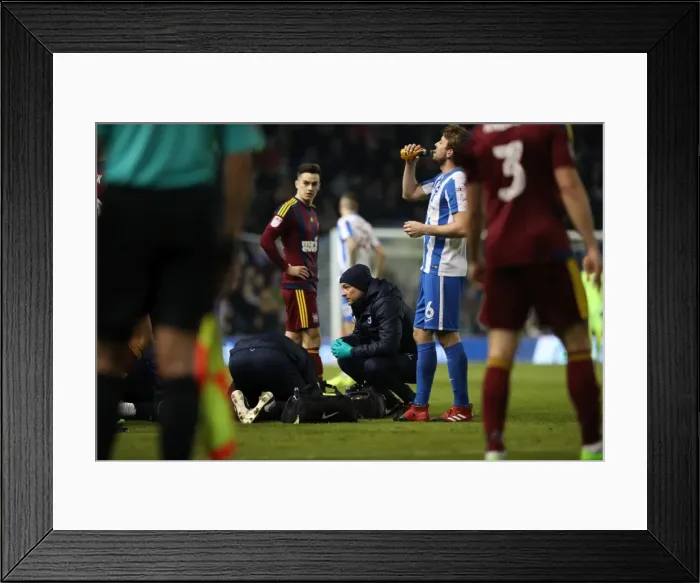 Framed Print : Brighton & Hove Albion: Club Doctor Stephen Lewis Tends to Injured Player during Ipswich Town Match, February 14, 2017