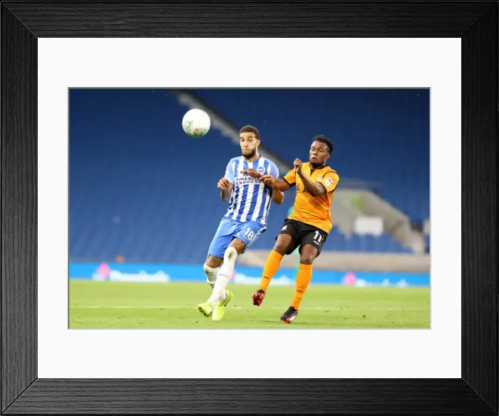 Framed Print : Brighton and Hove Albion vs Barnet: Intense Moment as Connor Goldson Faces Off Against Shaquile Coulthirst in the EFL Cup Framed Print : Brighton and Hove Albion vs Barnet: Intense Moment as Connor Goldson Faces Off Against Shaquile Coulthirst in the EFL Cup