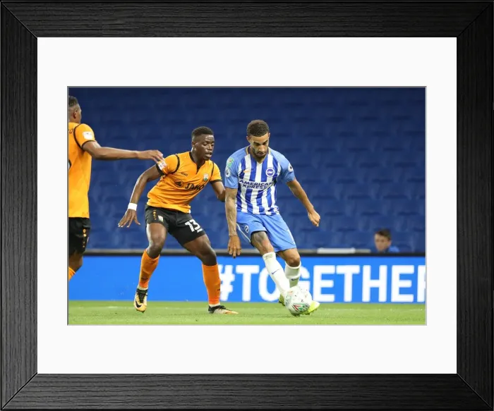 Framed Print : Goldson vs Tutonda: Intense Clash Between Brighton's Connor Goldson and Barnet's David Tutonda in the EFL Cup (22AUG17)