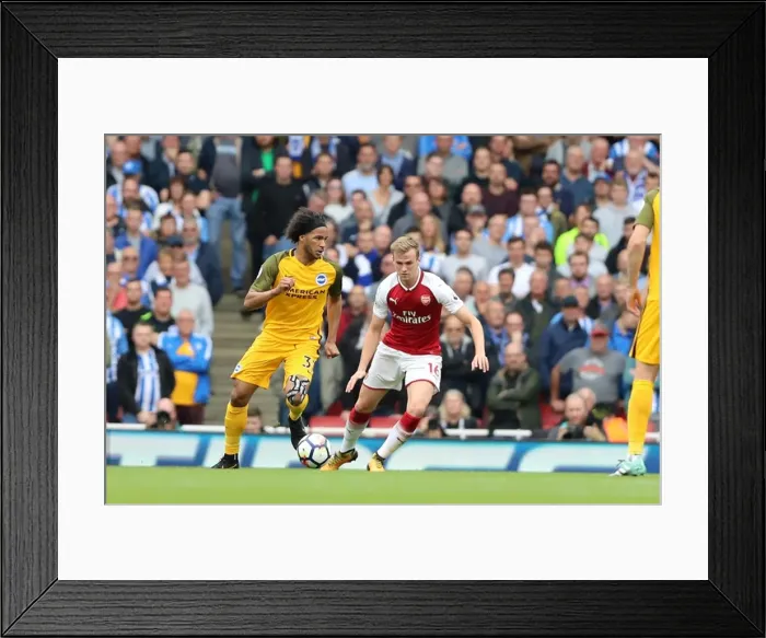 Framed Print : Isaiah Brown's Determined Run at Arsenal: A Premier League Clash (1st October 2017)