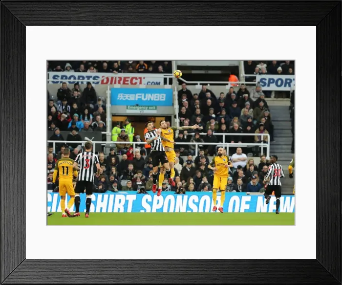Framed Print : Dunk vs. Joselu: Intense Battle Between Newcastle and Brighton Defender and Forward in Premier League Clash (30DEC17)