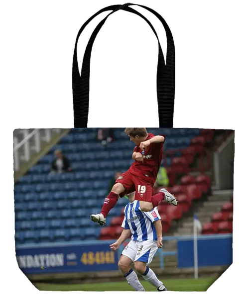 Jake Robinson scores the first of his debut hatrick at Huddersfield