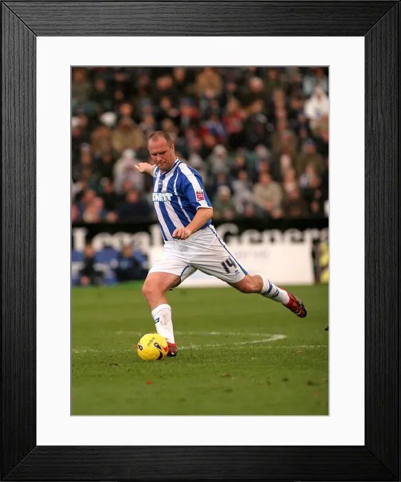 Framed Print : Brighton Midfielder Guy Butters Prepares to Strike the Ball