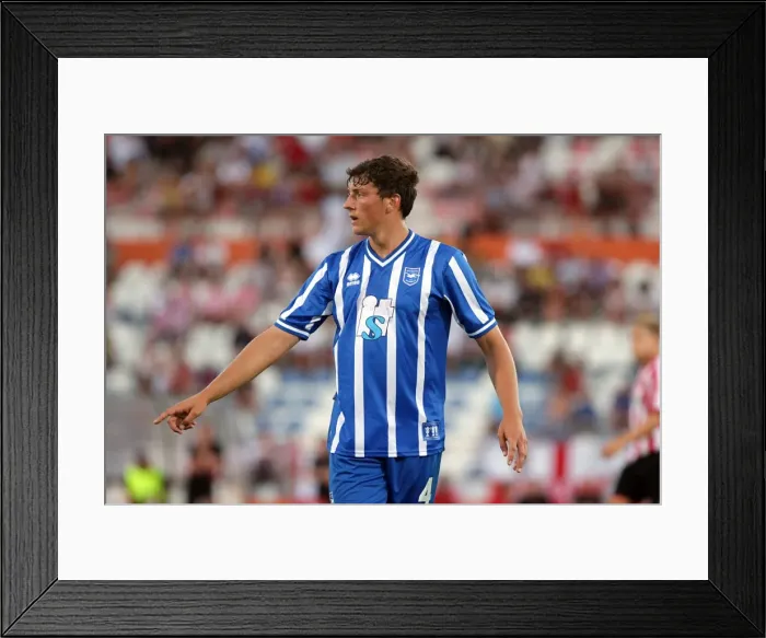 Framed Print : Brighton and Hove Albion's Proud Defender: Tommy Elphick
