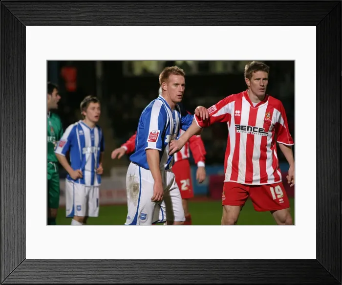 Framed Print : Kerry Mayo with Craig Armstrong of Cheltenham Town Framed Print : Kerry Mayo with Craig Armstrong of Cheltenham Town