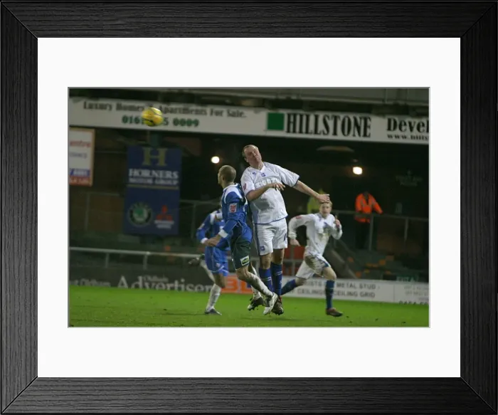 Framed Print : Guy Butters beats Oldhams Paul Warne in the air Framed Print : Guy Butters beats Oldhams Paul Warne in the air