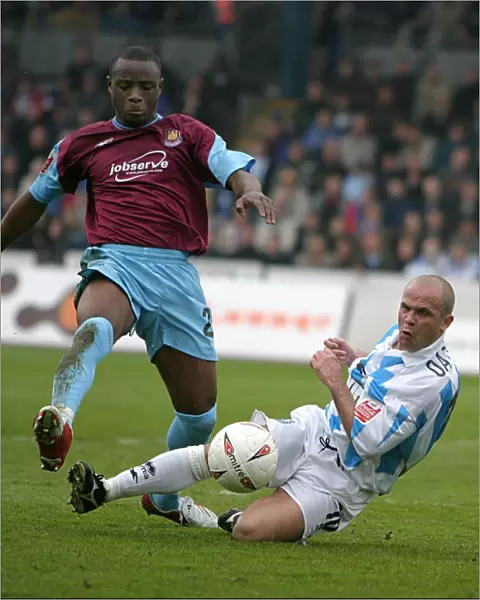 Charlie Oatway tackles Nigel Reo-Coker of West Ham (2004  /  05)