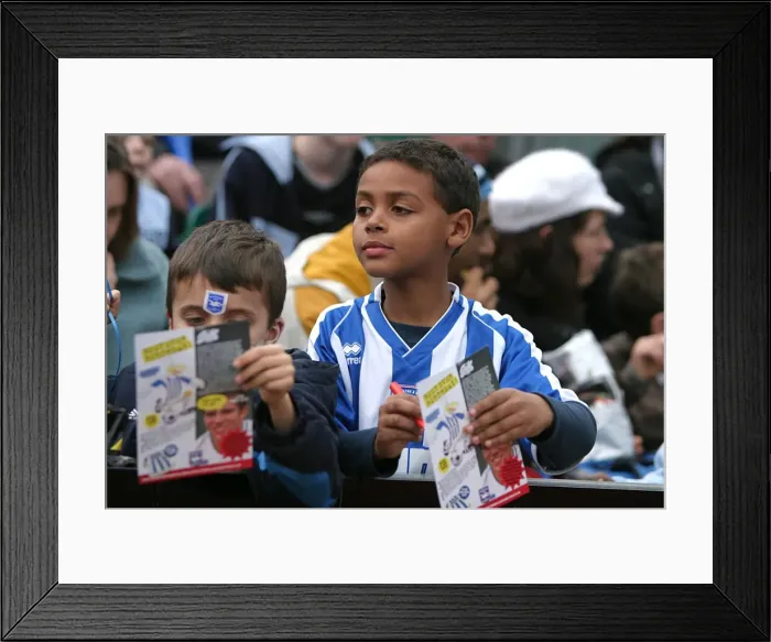 Framed Print : Albion fans in family stand v Nottingham Forest