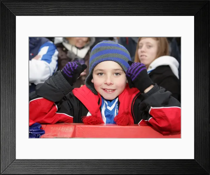 Framed Print : A young fan at Exeter City, January 2011 Framed Print : A young fan at Exeter City, January 2011