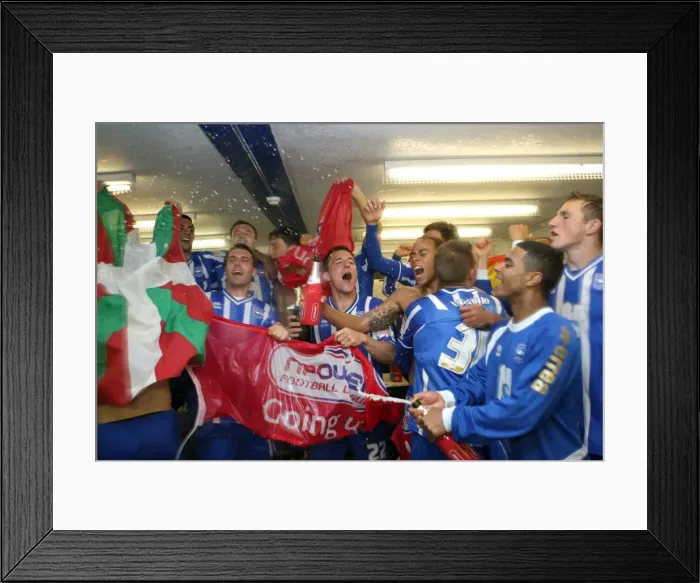 Framed Print : The players celebrate promotion to The Championship in 2011
