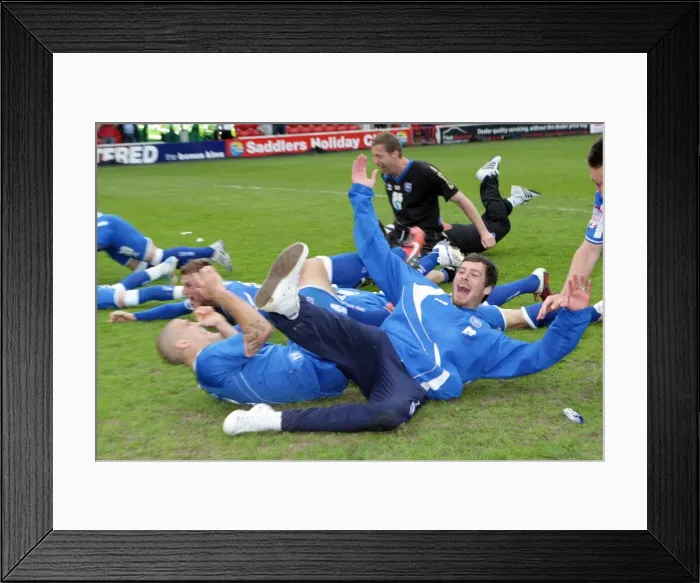 Framed Print : The players celebrate winning the League 1 title away at Walsall, April 2011 Framed Print : The players celebrate winning the League 1 title away at Walsall, April 2011