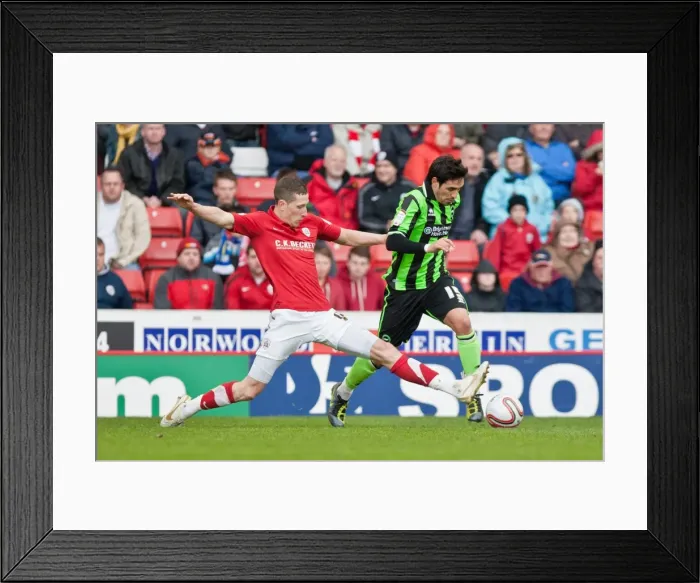 Framed Print : Intense Moment: Jim McNulty Chases Vicente in Npower Championship Clash between Barnsley and Brighton & Hove Albion, 2012 Framed Print : Intense Moment: Jim McNulty Chases Vicente in Npower Championship Clash between Barnsley and Brighton & Hove Albion, 2012
