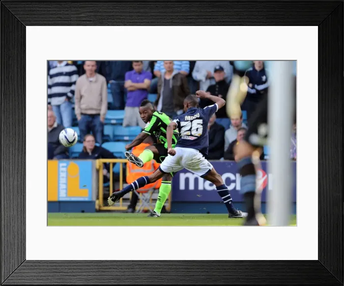Framed Print : Brighton & Hove Albion's Kazenga LuaLua Sends a Cross at Millwall, Championship Clash (September 22, 2012) Framed Print : Brighton & Hove Albion's Kazenga LuaLua Sends a Cross at Millwall, Championship Clash (September 22, 2012)