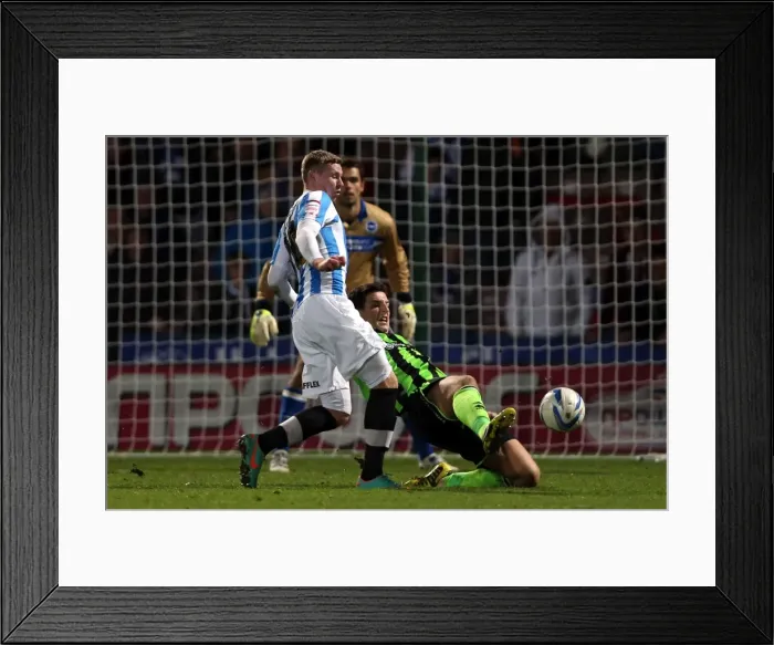 Framed Print : Lewis Dunk's Determined Slide Tackle in Brighton & Hove Albion's Win Against Huddersfield Town, Championship 2012