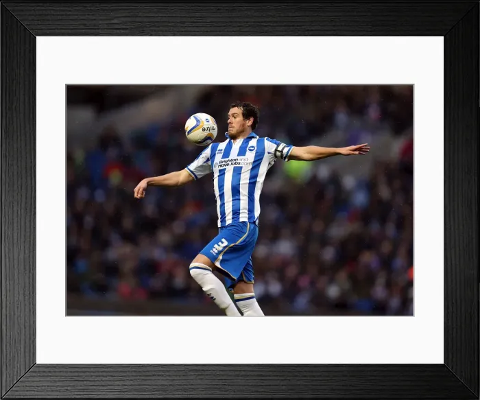 Framed Print : Gordon Greer Chests the Ball in Brighton & Hove Albion vs Bolton Wanderers, 2012