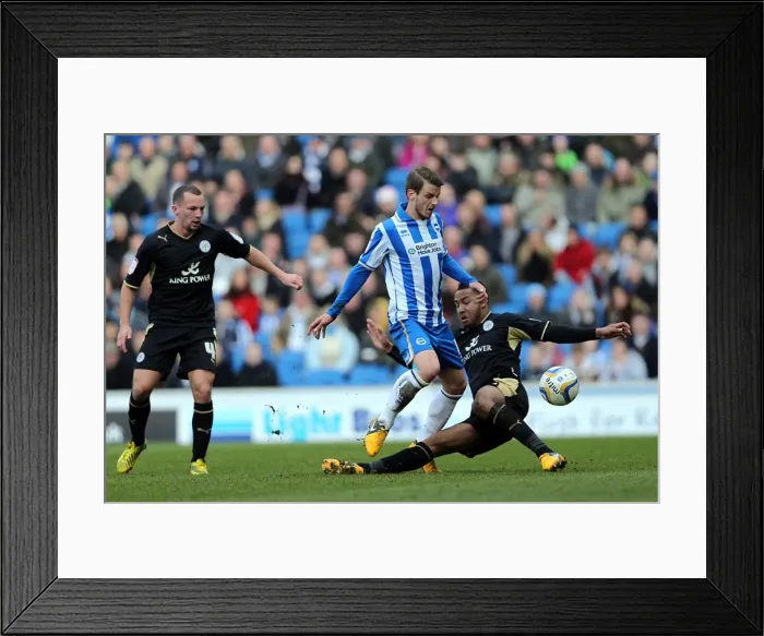 Framed Print : Andrea Orlandi Rides Tackle in Intense Brighton & Hove Albion vs Leicester City Championship Clash (April 6, 2013) Framed Print : Andrea Orlandi Rides Tackle in Intense Brighton & Hove Albion vs Leicester City Championship Clash (April 6, 2013)