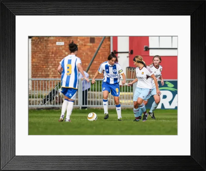 Framed Print : Battle on the Field: Brighton & Hove Albion vs. West Ham United - Women's Football Match, 2013-14 Season Framed Print : Battle on the Field: Brighton & Hove Albion vs. West Ham United - Women's Football Match, 2013-14 Season