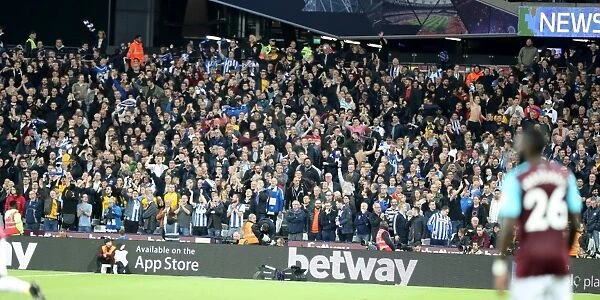 Brighton and Hove Albion Fans in Action: A Passionate Premier League Showdown against West Ham United (2017)