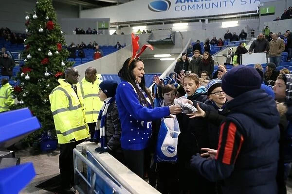 Brighton and Hove Albion vs. Millwall: A Festive Rivalry - Fans Share Christmas Cheer Amidst Championship Clash (12DEC14)