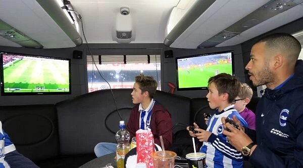 Brighton's Liam Rosenior Joins Fans for a Game of FIFA Aboard the Sky Bet 10 in 10 Bus to Birmingham City Match