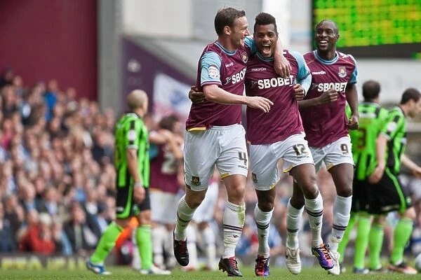 Celebrating Glory: Nolan, Vaz Te, and Cole in West Ham's Victory over Brighton & Hove Albion (April 14, 2012)