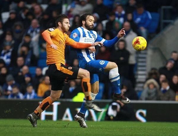 Clash at the Community Stadium: Intense Battle for High Ball Between James Henry and Inigo Calderon in Brighton and Hove Albion vs Wolverhampton Wanderers Championship Match (January 1, 2016)