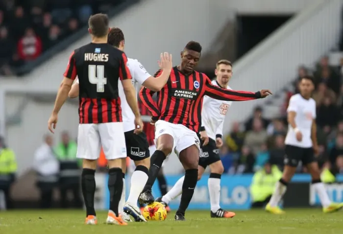 Framed Print : Derby vs Brighton: Intense Moment between Rohan Ince and Opponent in Championship Clash (December 2014)