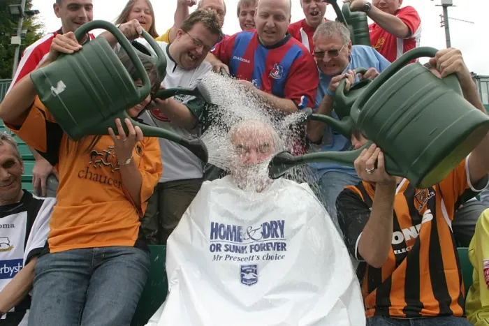 Framed Print : Des Lynam's Muddy Welcome: The Unforgettable Withdean Stadium Experience