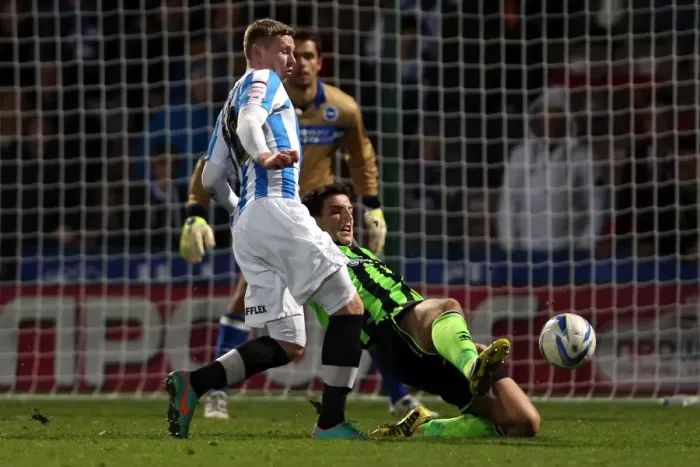 Framed Print : Lewis Dunk's Determined Slide Tackle in Brighton & Hove Albion's Win Against Huddersfield Town, Championship 2012
