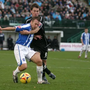 Adam Hinshelwood tussles with Gareth Taylor