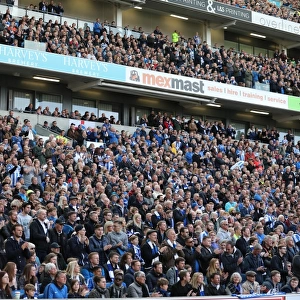 Brighton and Hove Albion Fans in Action: A Passionate Atmosphere at the American Express Community Stadium during the Championship Clash against Wigan Athletic (17th April 2017)