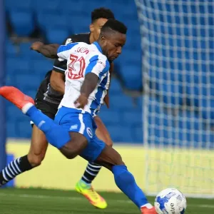 Brighton & Hove Albion's Kazenga LuaLua in Action against Colchester United during the EFL Cup First Round, 2016 Brighton & Hove Albion's Kazenga LuaLua in Action against Colchester United during the EFL Cup First Round, 2016