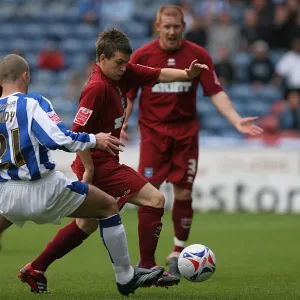 Dean Cox challenges in Midfield