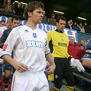 Dean Hammond leads Albion out at Boundary Park