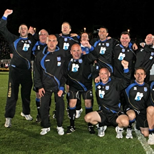Gus and his backroom staff celebrate promotion to The Championship in 2011