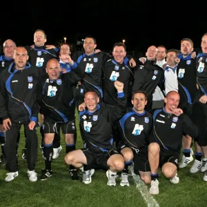 Gus and his backroom staff celebrate promotion to The Championship in 2011 Gus and his backroom staff celebrate promotion to The Championship in 2011