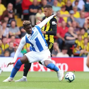 Intense Midfield Showdown: Bissouma vs. Capoue in the Premier League Battle between Watford and Brighton (11AUG18)
