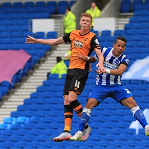 Intense Rivalry: Liam Rosenior and Sam Clucas Battle for the Ball in Brighton & Hove Albion vs. Hull City (12SEP15)