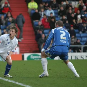 Jake Robinson with Oldhams Simon Charlton