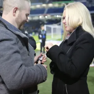 A Romantic Moment at the Soccer Field: Jamie Howell Proposes to Kristina Sinclair during Brighton and Hove Albion vs. Millwall (12DEC14)