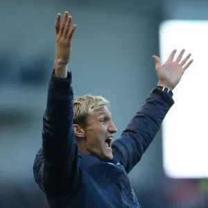 Sami Hyypia Celebrates Victory: Brighton and Hove Albion vs. Fulham, 2014
